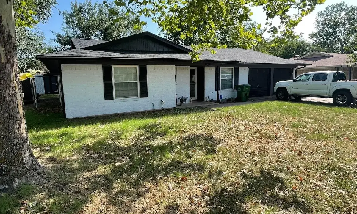 Professional roofing crew working on a residential roof in Peekskill